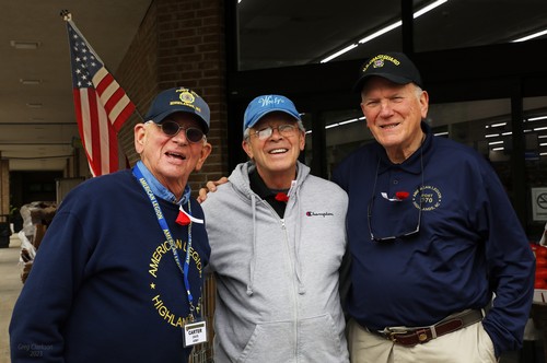 Post Legionnaires Dr. Carter Davis and Bill Edwards with a patriotic American.